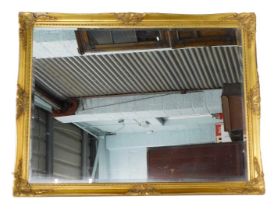 A rectangular wall mirror, with a bevelled plate, gilt frame, 137cm high. (AF)