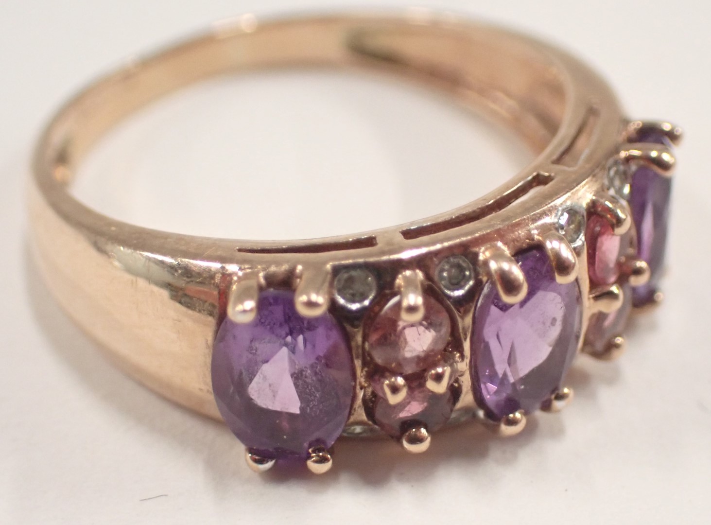 A 9ct rose gold dress ring, set with amethyst, pink topaz and cz, on half panelled design, ring - Image 2 of 3