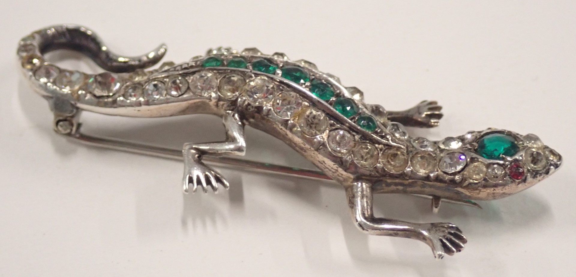 A 1950s lizard brooch, set with arrangement of green, white and red paste stones, in white metal set - Image 2 of 3