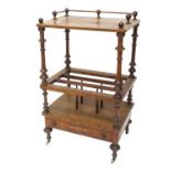 A Victorian figured walnut and marquetry Canterbury whatnot, the top with turned finials and brass t