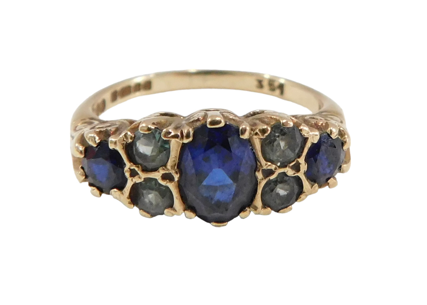 A sapphire and peridot gypsy ring, set with central oval sapphire flanked by two round brilliant cut