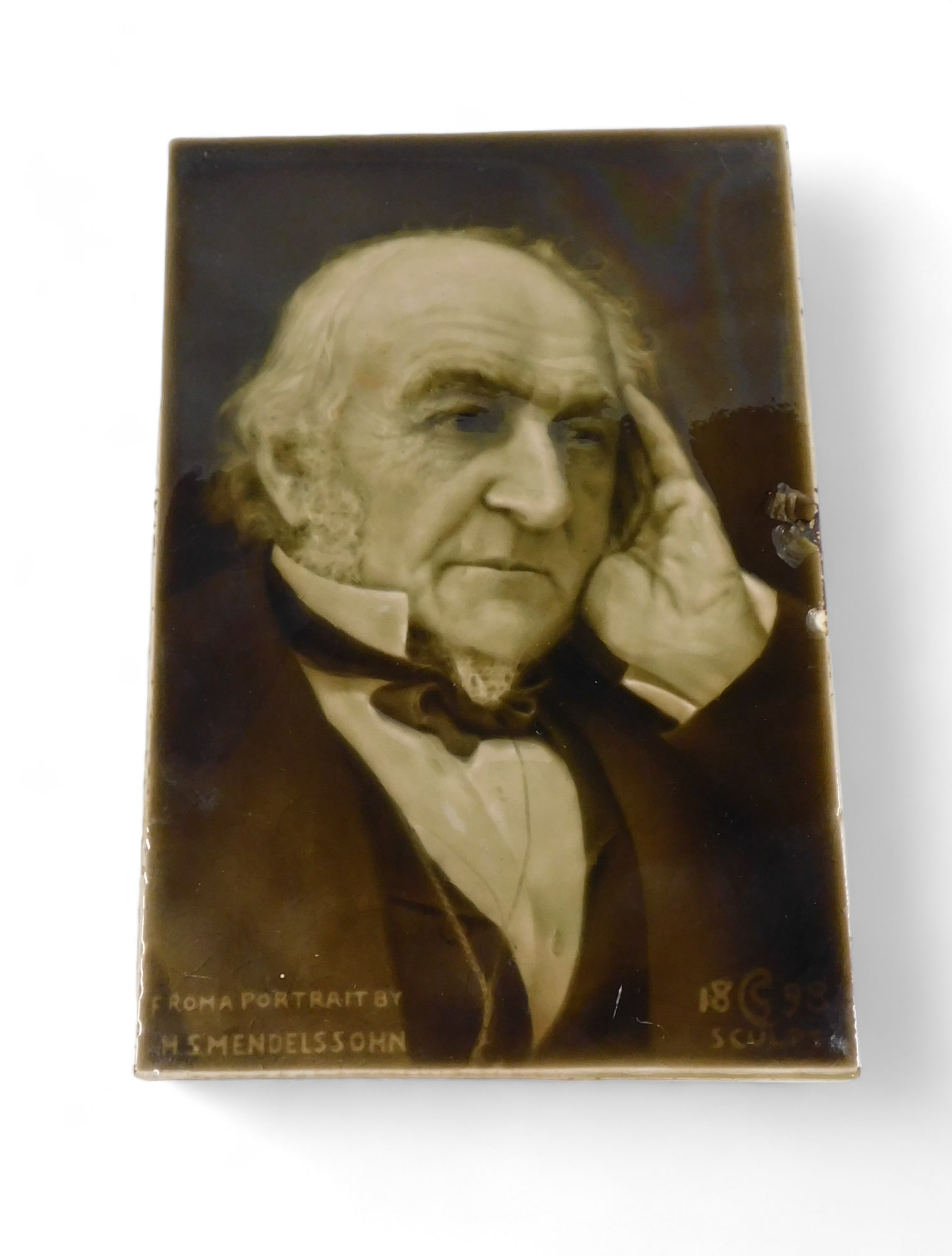 A 19thC Sherwin & Cotton ceramic tile, of William Gladstone from the portrait by Mendelssohn.