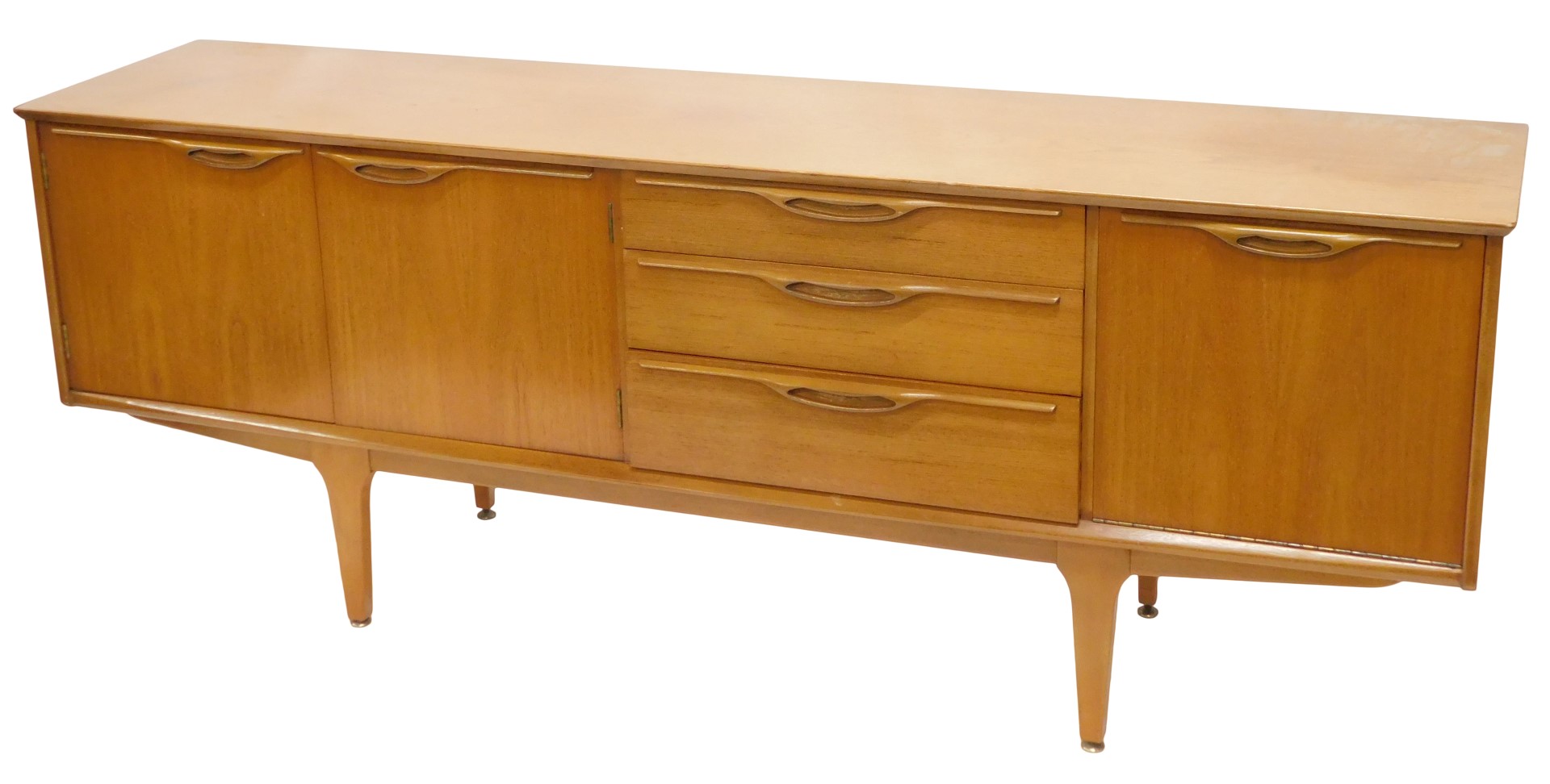 A 1960s/70s teak low sideboard, with arrangement of three drawers and three doors, on square taperin