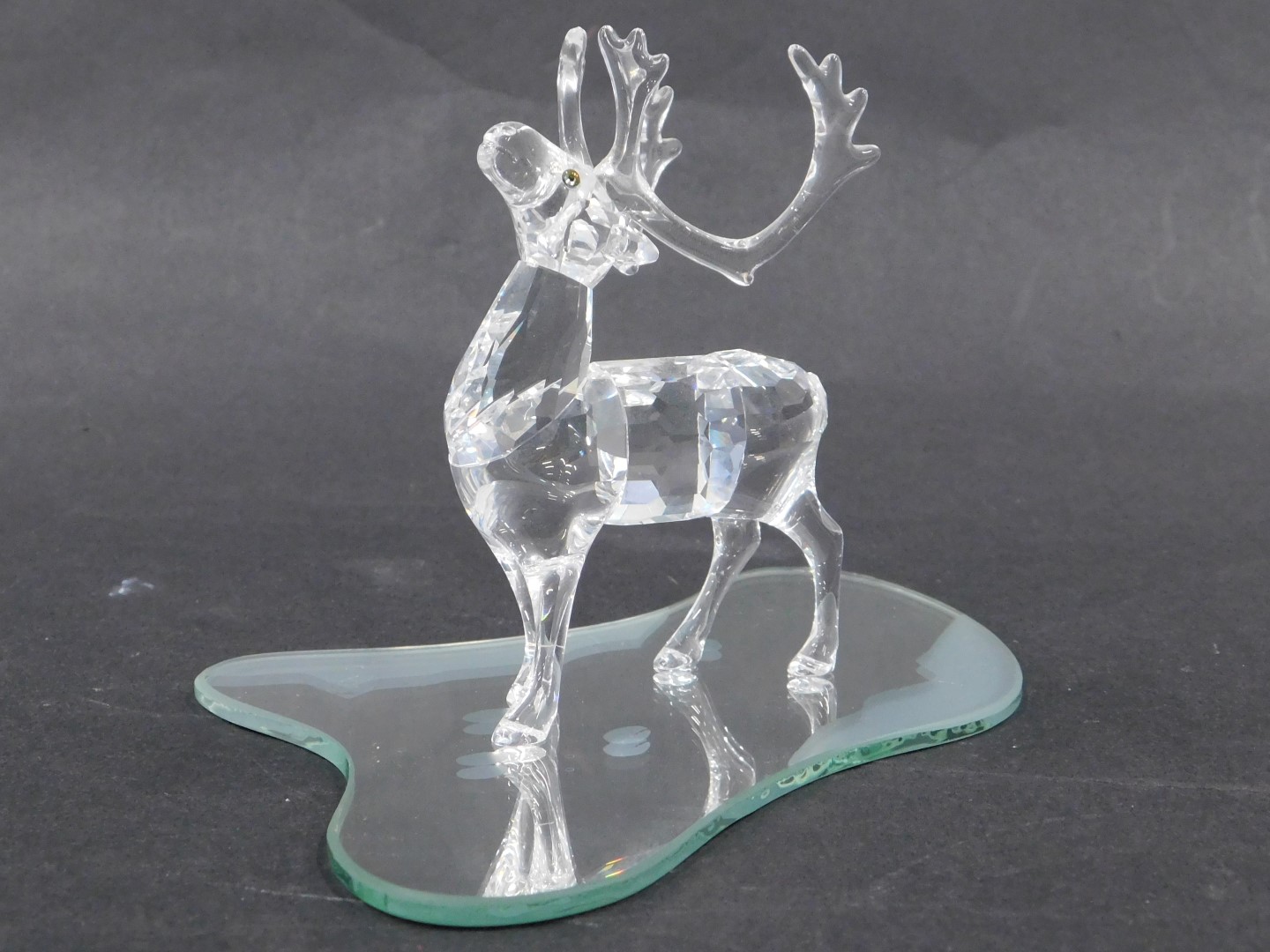 A Swarovski crystal figure of a stag, on circular base, 9cm high, boxed. - Image 2 of 2