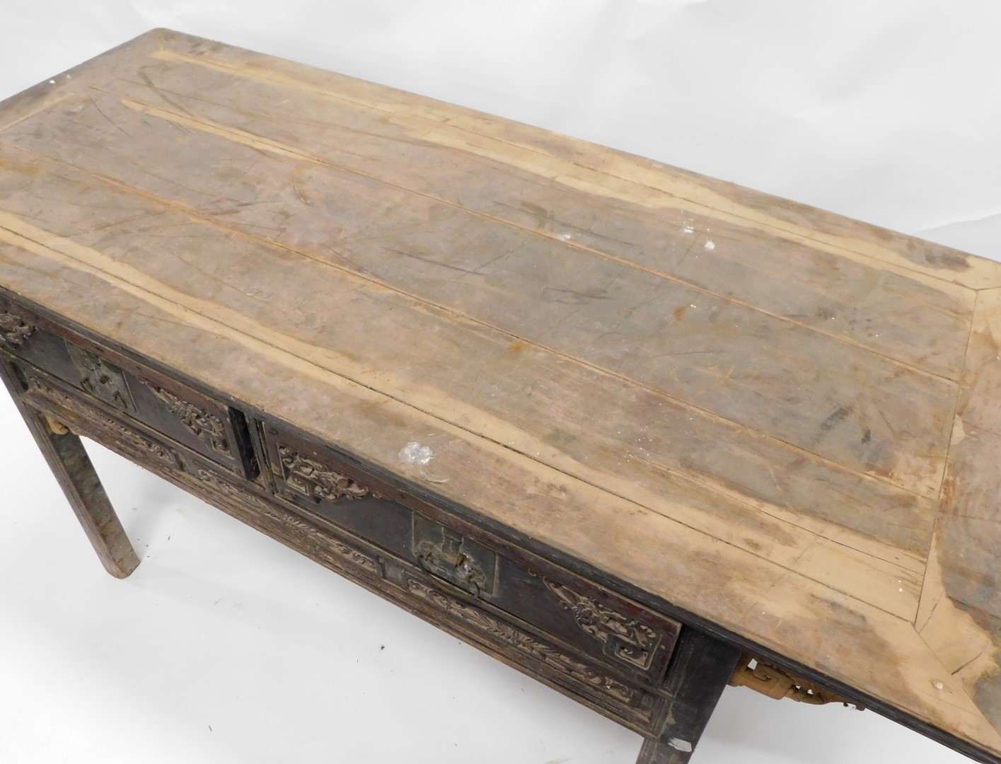 A Chinese red stained altar table, with a plank top above two carved frieze drawers flanked by pierc - Image 2 of 2