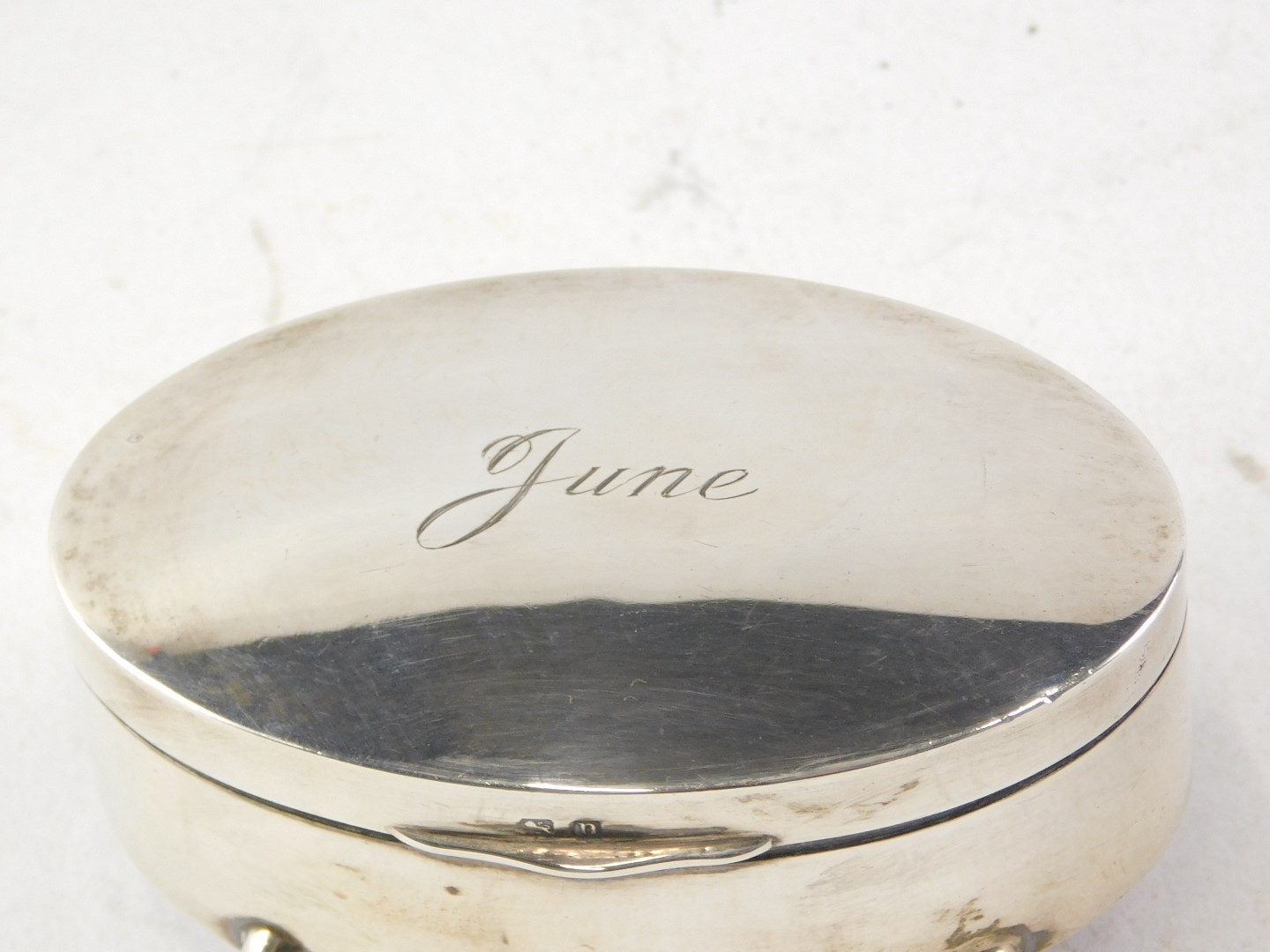 A George V oval silver jewellery box, of plain design, with hinged lid, engraved 'June', on four fee - Image 2 of 2