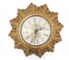 A Smiths wall clock, in gilt star shaped case, 25cm diameter.