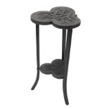 A late 19th/early 20thC ebonised oak occasional table, the trefoil top carved with scrolls and leave