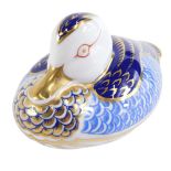 A Royal Crown Derby duck paperweight, on a blue and gilded ground, silver stopper, 12cm diameter.