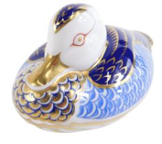A Royal Crown Derby duck paperweight, on a blue and gilded ground, silver stopper, 12cm diameter.