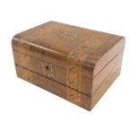 A Victorian walnut and parquetry writing box, the hinged lid enclosing a fitted interior, 30cm wide.