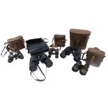 A quantity of binoculars, to include some in leather cases.