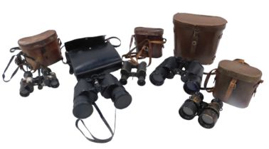 A quantity of binoculars, to include some in leather cases.