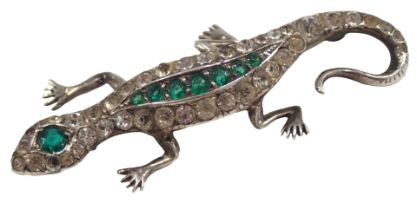 A 1950s lizard brooch, set with arrangement of green, white and red paste stones, in white metal set