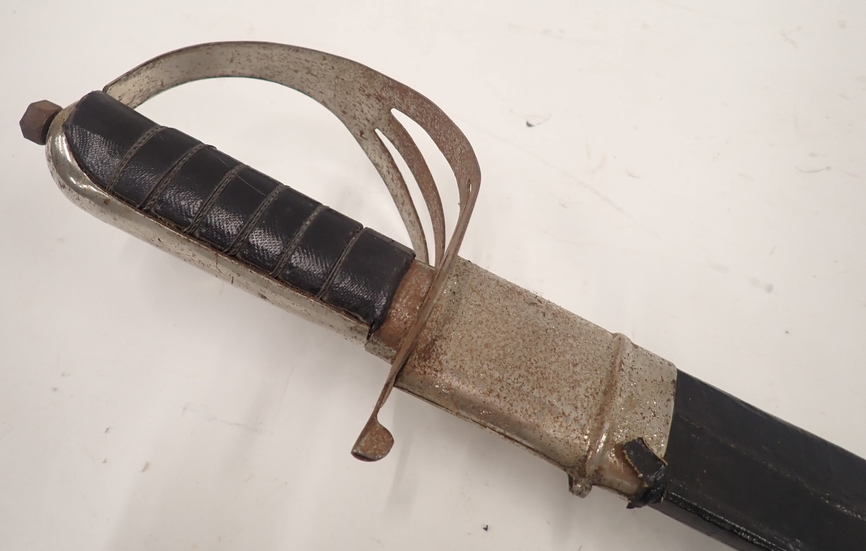 A 20thC sword, with curved and engraved blade, in leather scabbard, with shaped handle, 94cm long. - Image 2 of 4