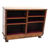 A late 19th/early 20thC walnut open bookcase, with adjustable shelves flanked by reeded pilasters, a