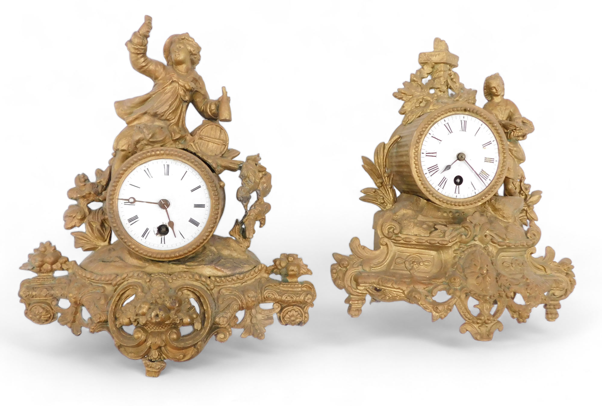 Two late 19th/early 20thC French gilt metal figural mantel clocks, each with a white enamel dial, bo
