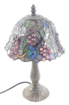 A small Tiffany style lamp, with stained glass shade and bronze effect base, 34cm high.