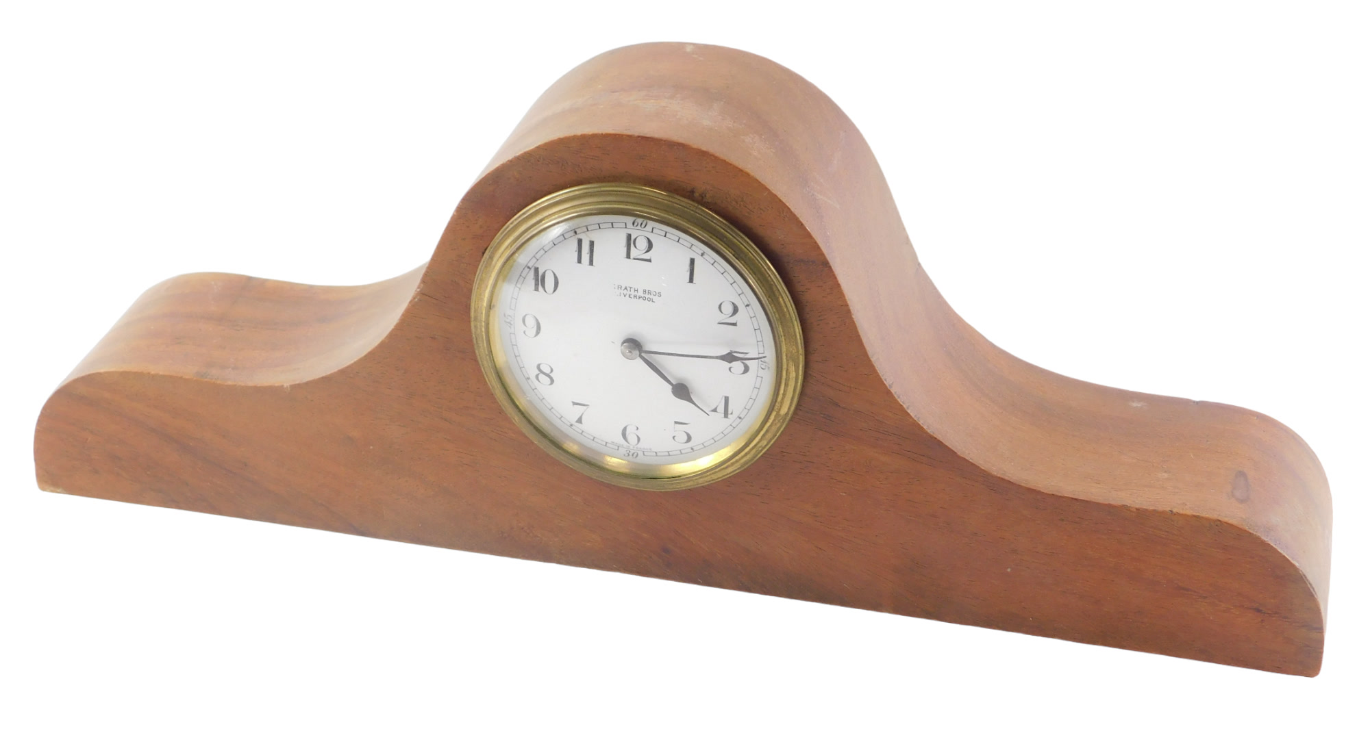 A mahogany mantel clock, the associated movement stamped McGrath Brothers Liverpool. 40cm wide.