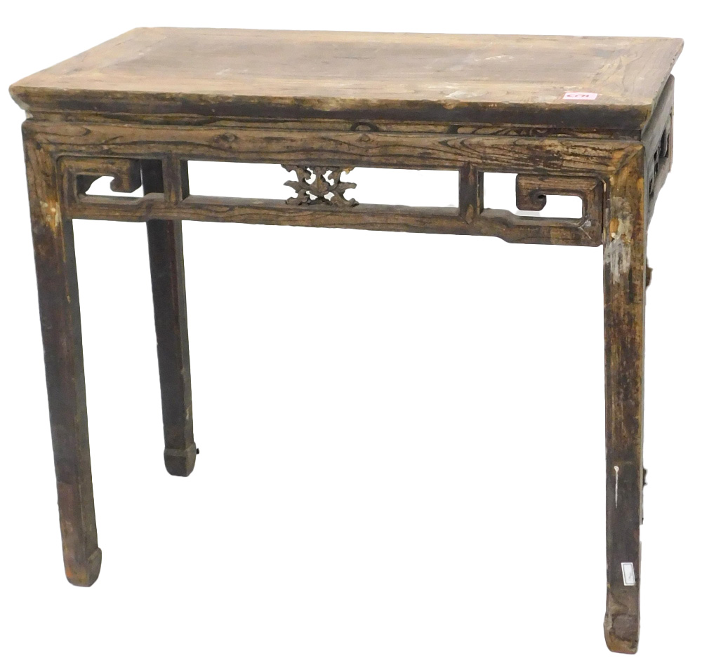 A Chinese elm altar table, with a pierced frieze, on shaped legs, 85cm high, 95cm wide.