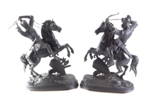 A pair of spelter figures of warriors on horseback, on ebonised bases, 46cm high.