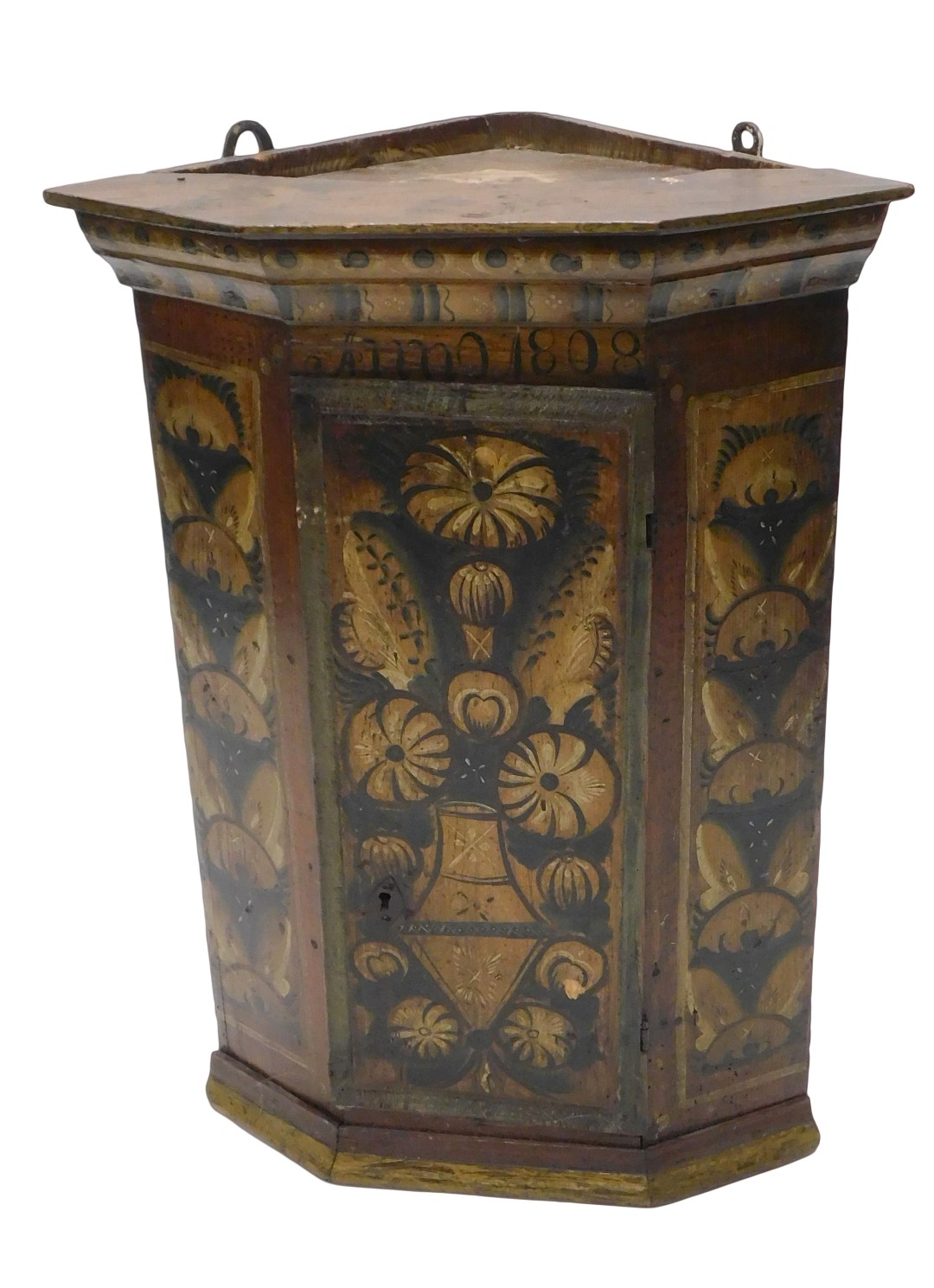 A 19thC Continental pine corner cupboard, bearing date ANO 1808, and painted with flowers, leaves, e