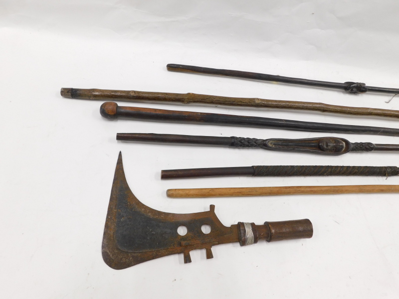 Two African axes or swords, each with a short handle, various tribal walking sticks, etc. - Image 3 of 3