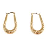 A pair of hoop earrings, the elongated hoops of twist design, yellow metal stamped 375, 3cm drop, 1.