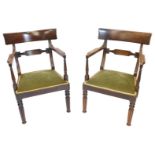 A pair of 19thC mahogany armchairs, each with a bar back, shaped arm supports, and a padded seat wit