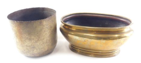 An oval brass planter or jardiniere, 39cm wide, and an Eastern engraved brass jardiniere, 22cm high.