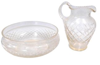 A cut glass wash jug and bowl, the jug 29cm high.