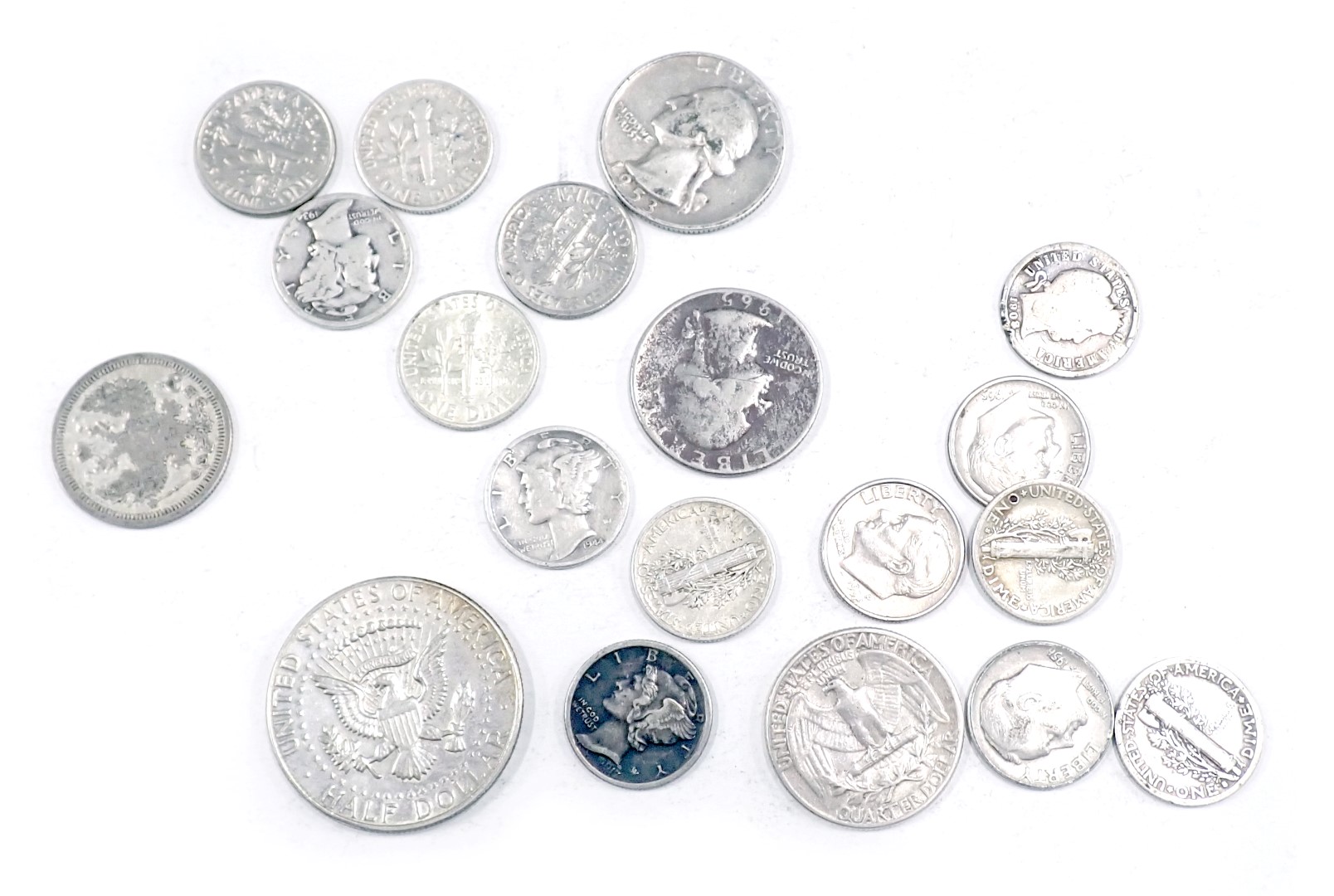 Eighteen USA silver coins, to include half dollar, etc., 67g.