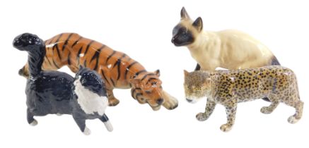 Four ceramic animal ornaments, comprising a Coopercraft Siamese cat, a tiger stamped Foreign, a USSR