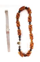 An imitation amber necklace and a lady's Santima stainless steel wristwatch. (2)