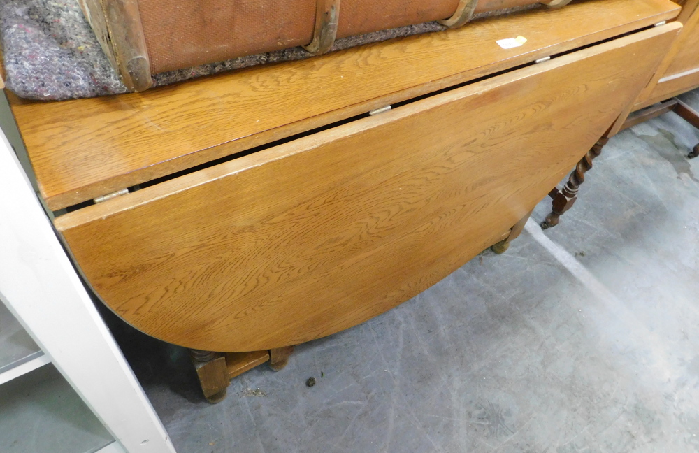 A light oak drop leaf table.