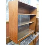 A beech effect bookcase and two mahogany bedside tables. (3)