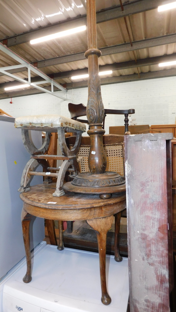 A 20thC oak torchere stand, cross seated in upholstered stool, and an oak side table. (3)