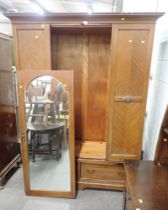 A 20thC mahogany double wardrobe, with mirror glazed door above arrangement of two drawers.