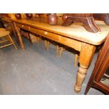 A large rustic pine rectangular kitchen table, with two drawers, 77cm high, 183cm wide, 82cm deep.