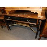 An ebonised G-Plan side table with teak top and single drawer.