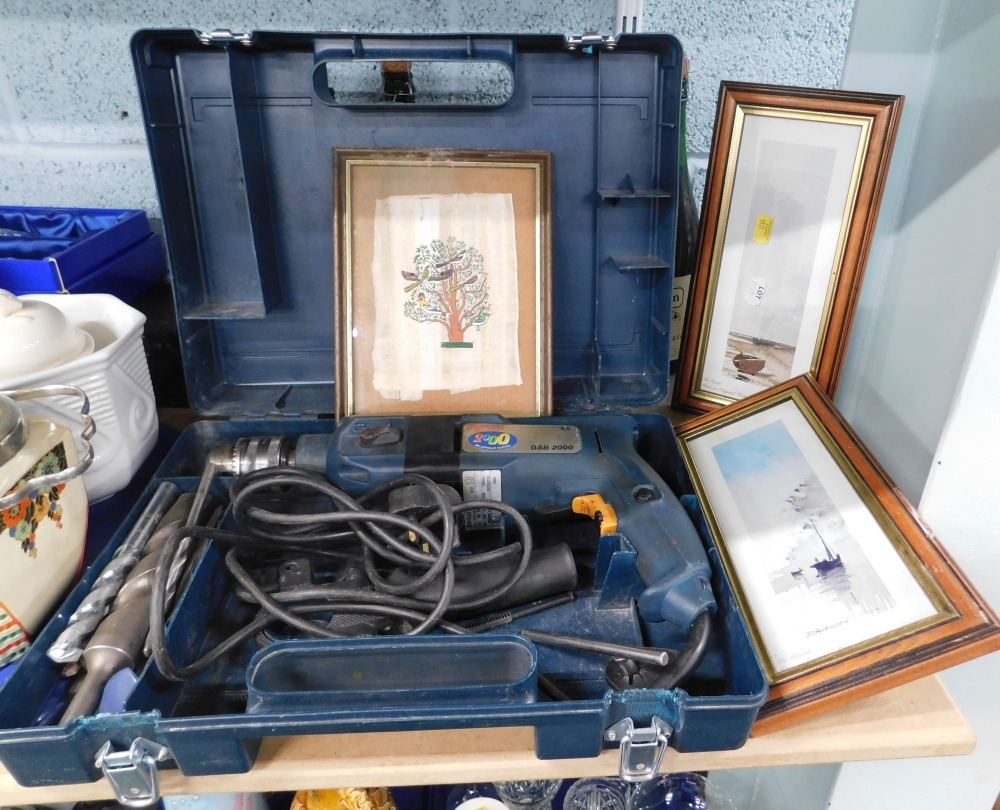 A Bosch 240V drill, cased, together with various prints.