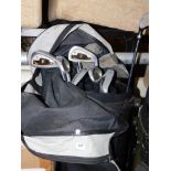 A Donnay International golf club carry bag and contents of Evolution golf clubs. Buyer Note: VAT pa