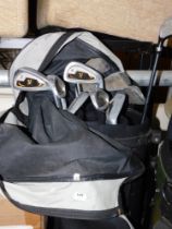A Donnay International golf club carry bag and contents of Evolution golf clubs. Buyer Note: VAT pa