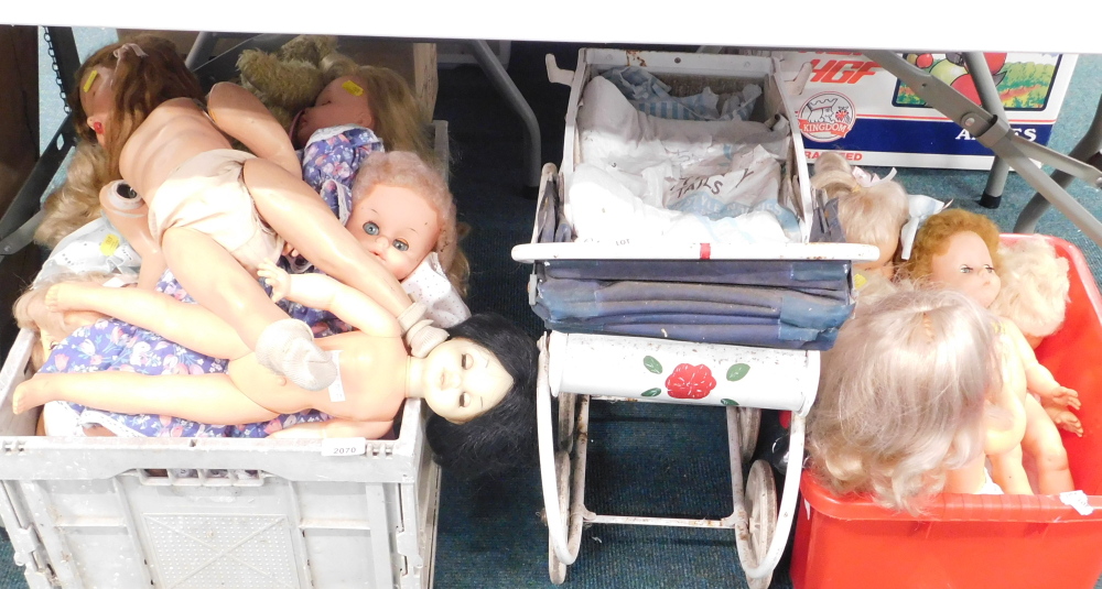 Various mid century dolls, together with pram. Buyer Note: VAT payable on the hammer price of this