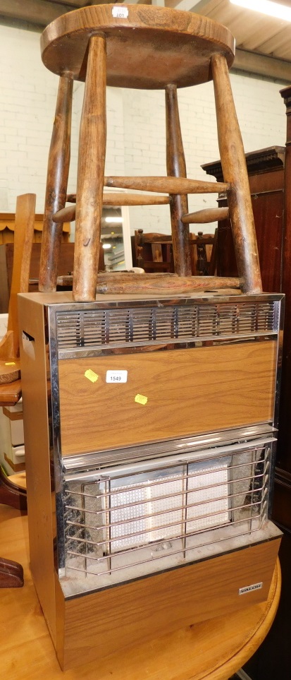 A pine oval stool and a gas fire surround.