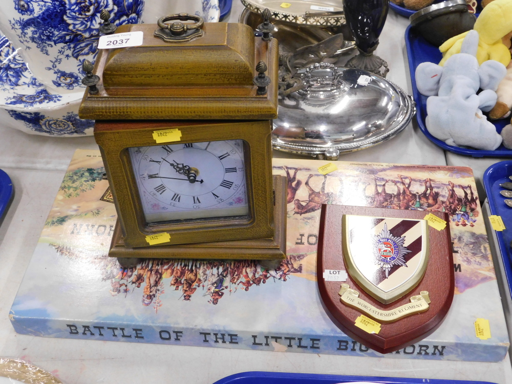 An oak cased mantel clock, together with a Battle of the Little Big Horn board game, and a Worcester