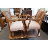 A pair of 1950s armchairs, each with cream and terracotta upholstered seat. (2)