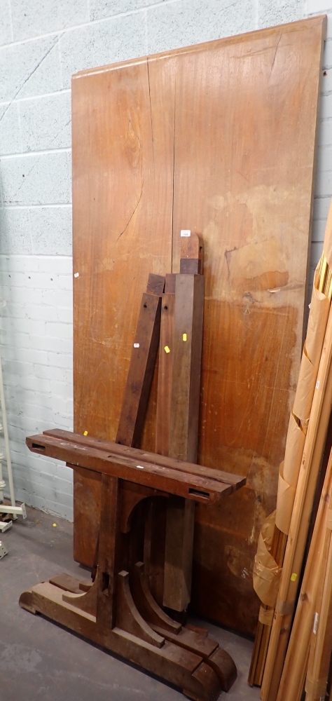 A mahogany refectory table, with two plank top, on trestle support ends,