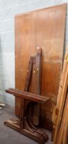 A mahogany refectory table, with two plank top, on trestle support ends,