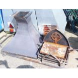 Withdrawn pre-sale. A mid 20thC Bob Cakes blacksmith made fire grate in gothic style, fireside